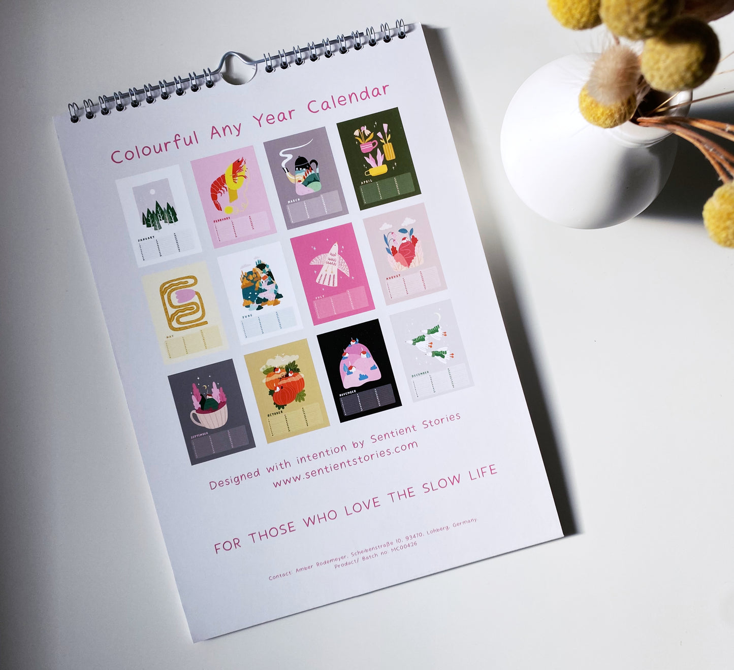 Colorful Any Year Calendar with illustrations on a white surface