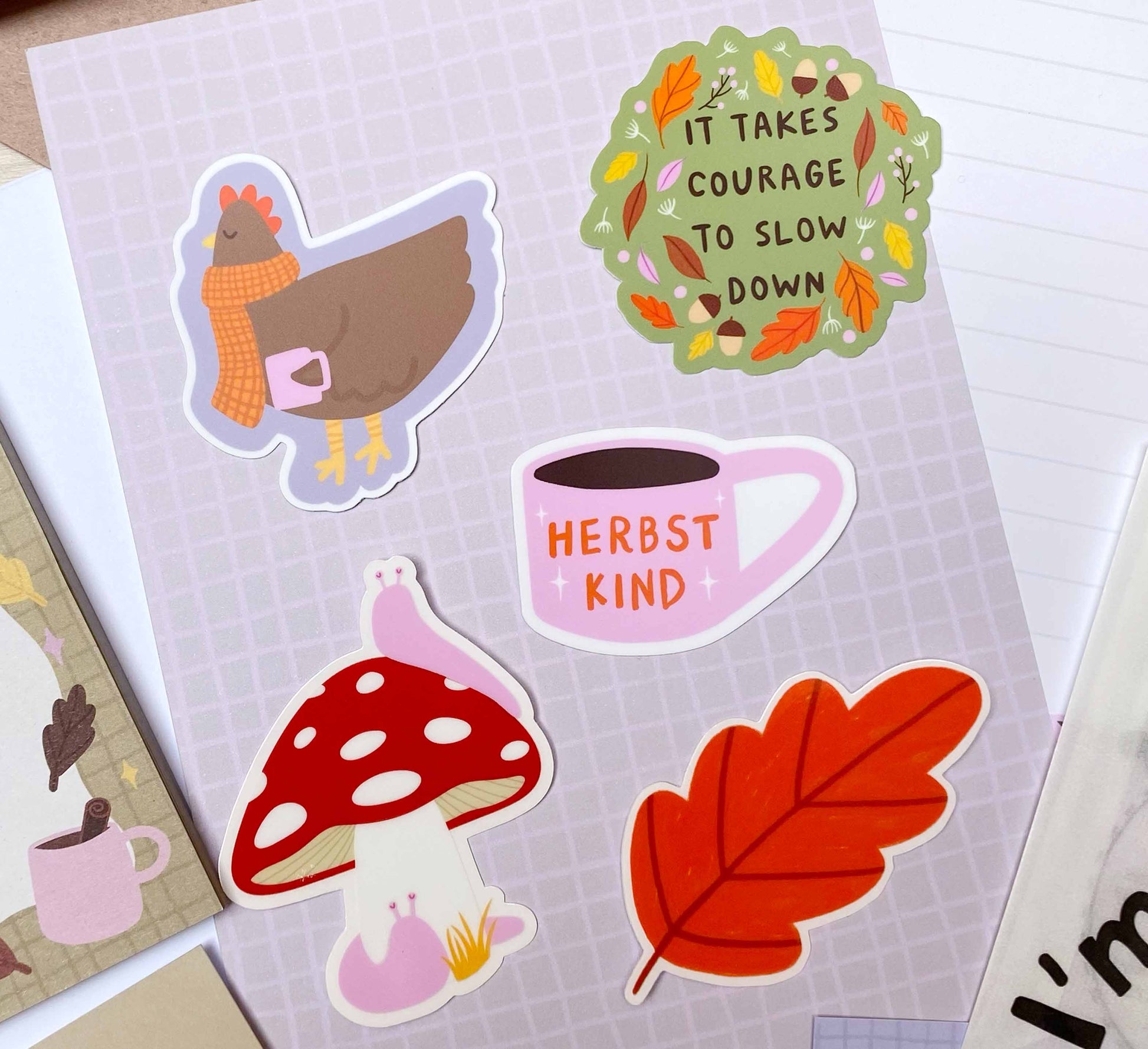 Set of 5 autumn-themed vinyl stickers featuring cosy chickens, leaves, toadstools, slugs and warm tea! Celebrate fall with this cute set, perfect for decorating laptops or notebooks. Made by an independent artist and female-owned small business from the Bavarian Forest, Germany. Sales support nature conservation through European Rewilding projects!