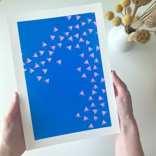 Slightly imperfect print of pink birds against a blue sky! High-quality, independently designed wall-art and prints for your home, perfect for bringing a little nature into any living space! Low-waste, sustainable, imperfect prints sale!